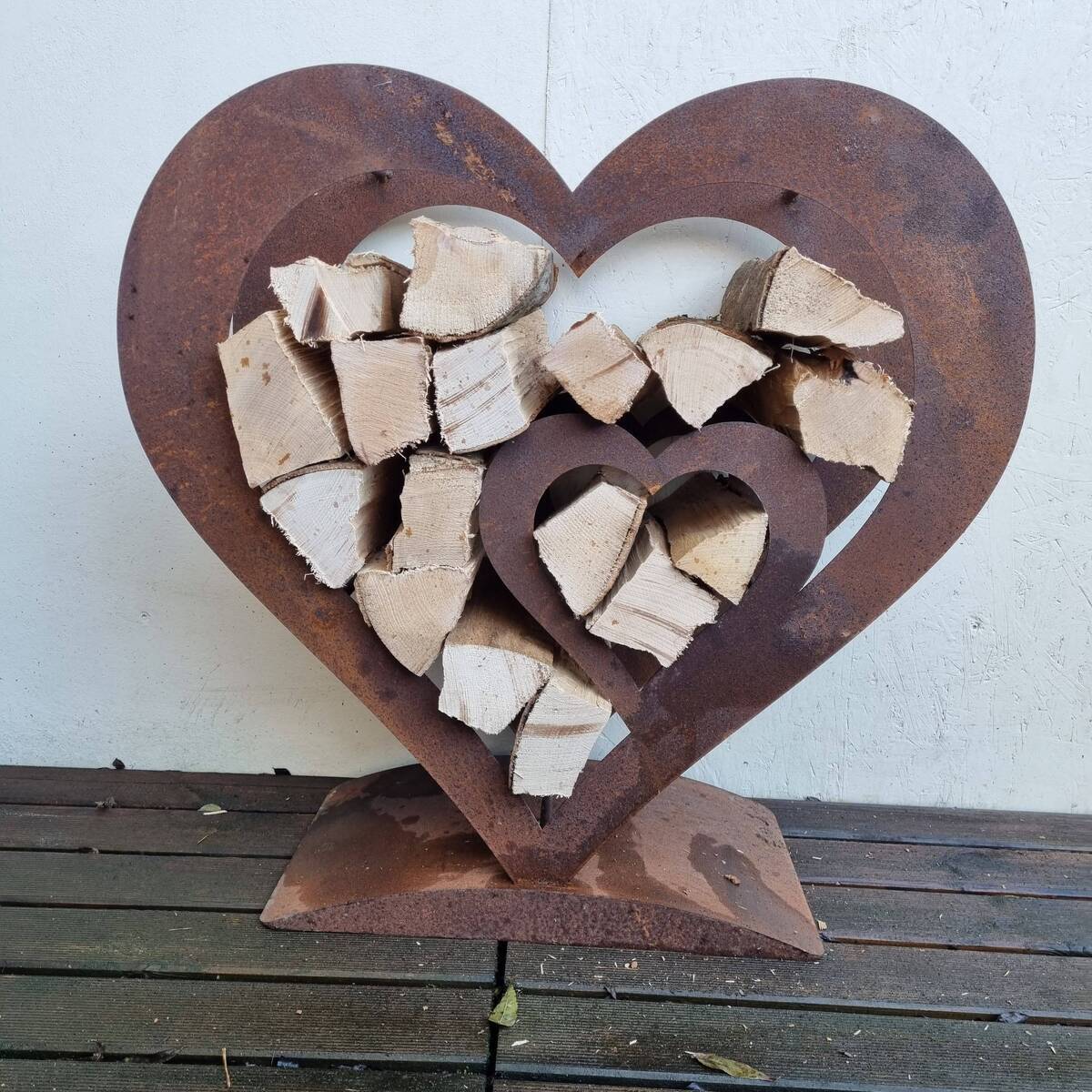 Coeur en fer rouillé, pour bois de cheminée, H. 72cm
