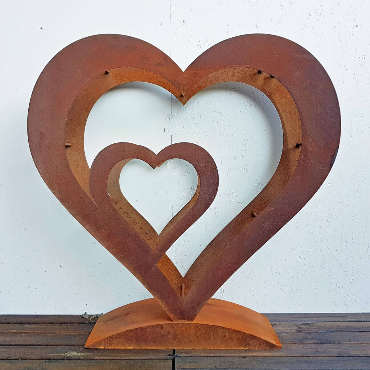 Coeur en fer rouillé, pour bois de cheminée, H. 100cm