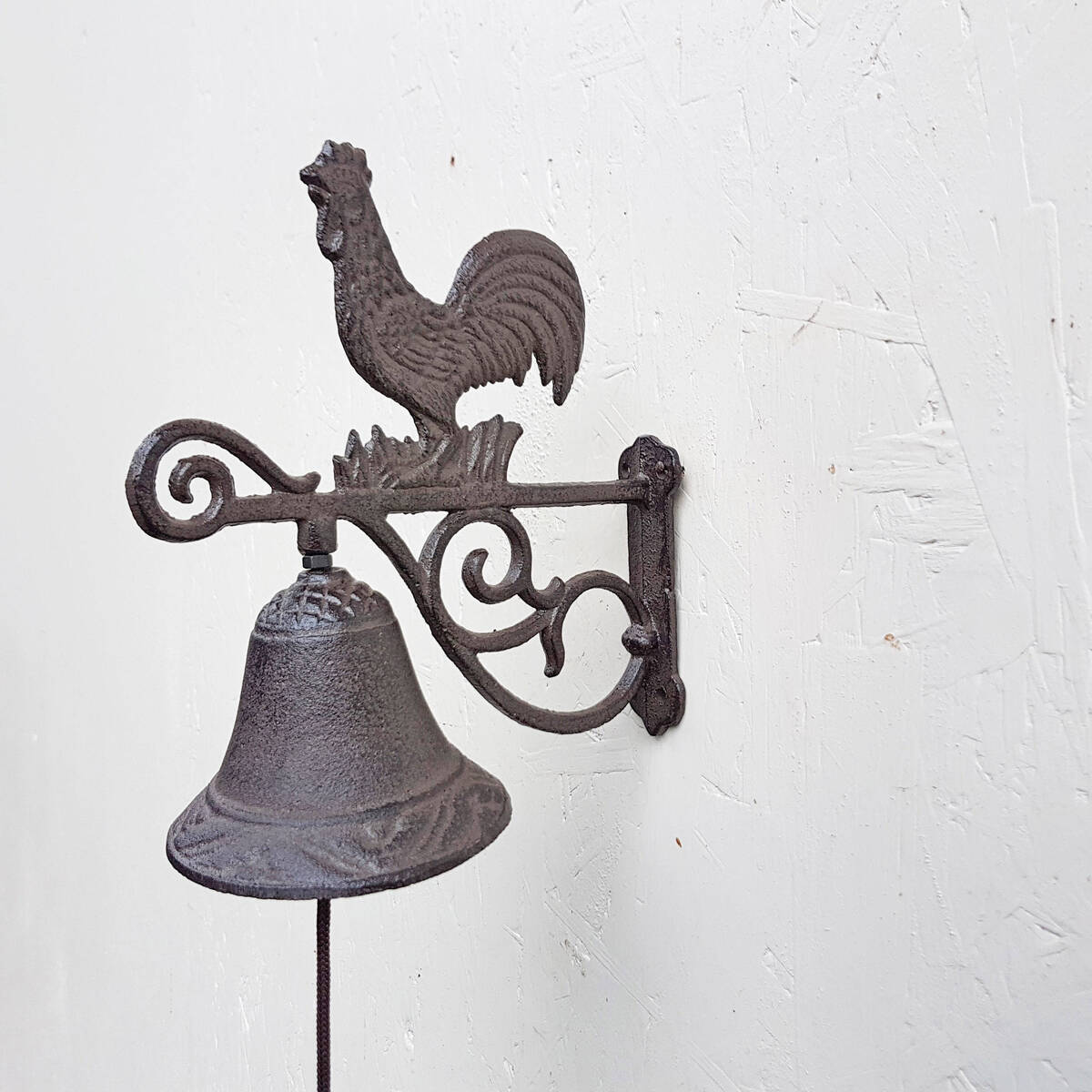 Cloche en fonte, coq