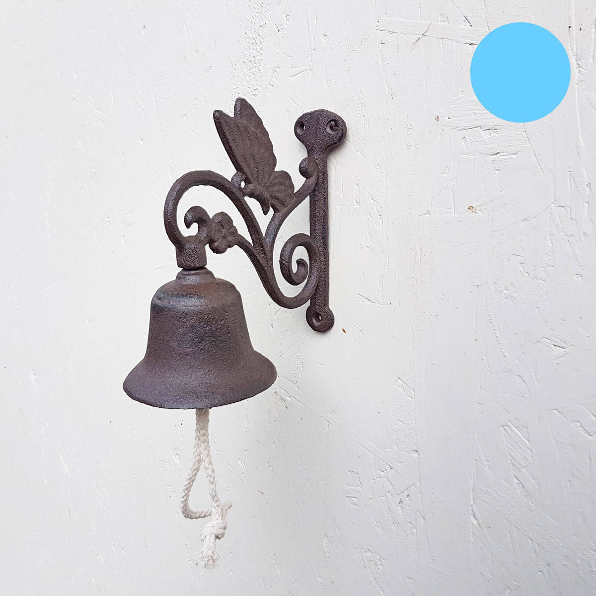 Cloche en fonte, papillon